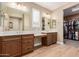 Bathroom boasts double vanity and walk-in closet access at 16746 W La Reata Ave, Goodyear, AZ 85395