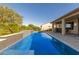 Inviting rectangular pool with a waterfall feature at 16746 W La Reata Ave, Goodyear, AZ 85395