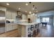 Open concept kitchen with an island and views into the game room at 17718 E Bear Wallow Way, Rio Verde, AZ 85263