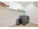 Laundry room with washer, dryer, and overhead shelving at 17917 W Amberwood Dr, Goodyear, AZ 85338