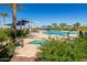 Large community pool with shaded seating areas at 17917 W Amberwood Dr, Goodyear, AZ 85338