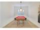 Game room featuring a pool table, chandelier, and wall-mounted cue rack at 17917 W Amberwood Dr, Goodyear, AZ 85338