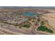 Expansive community view, featuring a lake and numerous homes at 17917 W Amberwood Dr, Goodyear, AZ 85338