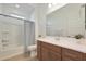 Clean bathroom with tub, shower, and wood vanity at 17917 W Amberwood Dr, Goodyear, AZ 85338
