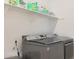 Bright laundry room with a front load washer and dryer at 17917 W Amberwood Dr, Goodyear, AZ 85338