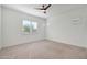 Well-lit bedroom featuring a ceiling fan and window shutters at 17917 W Amberwood Dr, Goodyear, AZ 85338