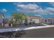 Single story home with front yard landscaping and two car garage at 17917 W Amberwood Dr, Goodyear, AZ 85338