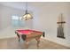Game room with pool table and plenty of space to play at 17917 W Amberwood Dr, Goodyear, AZ 85338