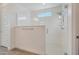 Large walk-in shower with glass enclosure and window at 17917 W Amberwood Dr, Goodyear, AZ 85338