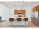 Modern kitchen island with seating for three at 17917 W Amberwood Dr, Goodyear, AZ 85338