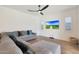 Spacious Gathering room with a sectional sofa and large TV at 17917 W Amberwood Dr, Goodyear, AZ 85338
