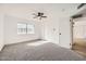 Spacious bedroom featuring carpet, ceiling fan, and ample closet space at 7243 W San Juan Ave, Glendale, AZ 85303