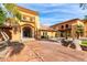 Tuscan-style clubhouse with inviting entryway and landscaping at 3582 N 160Th Ave, Goodyear, AZ 85395