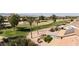 Aerial view of a house near a golf course with mountain views at 3582 N 160Th Ave, Goodyear, AZ 85395