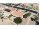 An aerial view showcasing a house with a pool, solar panels and walkway at 3582 N 160Th Ave, Goodyear, AZ 85395