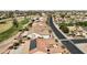 Aerial view of houses with solar panels and a street at 3582 N 160Th Ave, Goodyear, AZ 85395