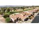 Aerial view of a house on a golf course with mountain views at 3582 N 160Th Ave, Goodyear, AZ 85395