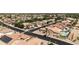 Aerial view of a residential neighborhood with houses and a golf course at 3582 N 160Th Ave, Goodyear, AZ 85395
