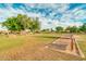 Community lawn area with horseshoe and shuffleboard courts at 3582 N 160Th Ave, Goodyear, AZ 85395