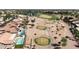 Aerial view of a golf course and houses with pools at 3582 N 160Th Ave, Goodyear, AZ 85395