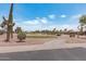 Landscaped golf course with walking path and desert plants at 3582 N 160Th Ave, Goodyear, AZ 85395