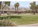 Aerial view showing home with solar panels and golf course views at 3582 N 160Th Ave, Goodyear, AZ 85395