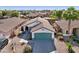 Single story home with attached garage and desert landscaping at 14735 W Willow Ln, Surprise, AZ 85374