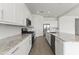 Modern kitchen with white cabinets, granite countertops and island at 19151 W Coolidge St, Litchfield Park, AZ 85340