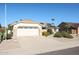 House exterior with a two-car garage and mature shrubs at 14908 W Alpaca Dr, Sun City West, AZ 85375