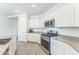 Modern kitchen with stainless steel appliances and light-colored cabinetry at 453 E Wiley Way, Casa Grande, AZ 85122