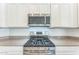 Stainless steel gas range with overhead microwave at 453 E Wiley Way, Casa Grande, AZ 85122
