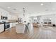 Open concept kitchen with island, stainless steel appliances, and white cabinets at 453 E Wiley Way, Casa Grande, AZ 85122