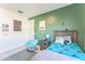 bedroom with green walls and twin bed at 453 E Wiley Way, Casa Grande, AZ 85122