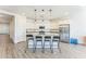 Kitchen island with four barstools and pendant lighting at 453 E Wiley Way, Casa Grande, AZ 85122