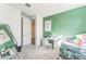 Cozy bedroom with green accent wall and full-size bed at 453 E Wiley Way, Casa Grande, AZ 85122