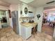 Kitchen features a built-in desk and stainless steel refrigerator at 11634 N Rio Vista Dr, Sun City, AZ 85351