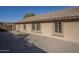 View of the home's side showcasing windows and yard at 3291 E Latham Way, Gilbert, AZ 85297