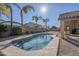 Relaxing backyard pool with palm trees and patio furniture at 3291 E Latham Way, Gilbert, AZ 85297