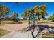 Community playground with swings and playset at 1018 W Juniper Ave, Gilbert, AZ 85233