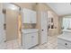 Bright kitchen with white cabinets and tile flooring at 1018 W Juniper Ave, Gilbert, AZ 85233