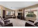 Bright and airy living room with comfortable seating and large TV at 1018 W Juniper Ave, Gilbert, AZ 85233