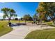 Community playground with playset, swings, and benches at 1018 W Juniper Ave, Gilbert, AZ 85233