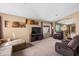 Spacious living room with neutral carpeting and a view to the dining area at 1018 W Juniper Ave, Gilbert, AZ 85233