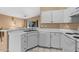 Clean and efficient kitchen with white cabinets and modern appliances at 1018 W Juniper Ave, Gilbert, AZ 85233