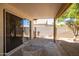 Covered patio with table and chairs, access from sliding glass door at 1018 W Juniper Ave, Gilbert, AZ 85233