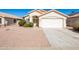 Single-story house with a two-car garage and well-maintained landscaping at 1018 W Juniper Ave, Gilbert, AZ 85233