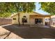 Large backyard, covered patio, mature trees, and a grassy area at 1018 W Juniper Ave, Gilbert, AZ 85233