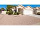 Single-story house with a two-car garage and desert landscaping at 1018 W Juniper Ave, Gilbert, AZ 85233