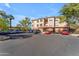 Building exterior with ample parking and landscaping at 14950 W Mountain View Blvd # 1105, Surprise, AZ 85374