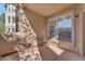 Private patio with seating area and large window at 14950 W Mountain View Blvd # 1105, Surprise, AZ 85374